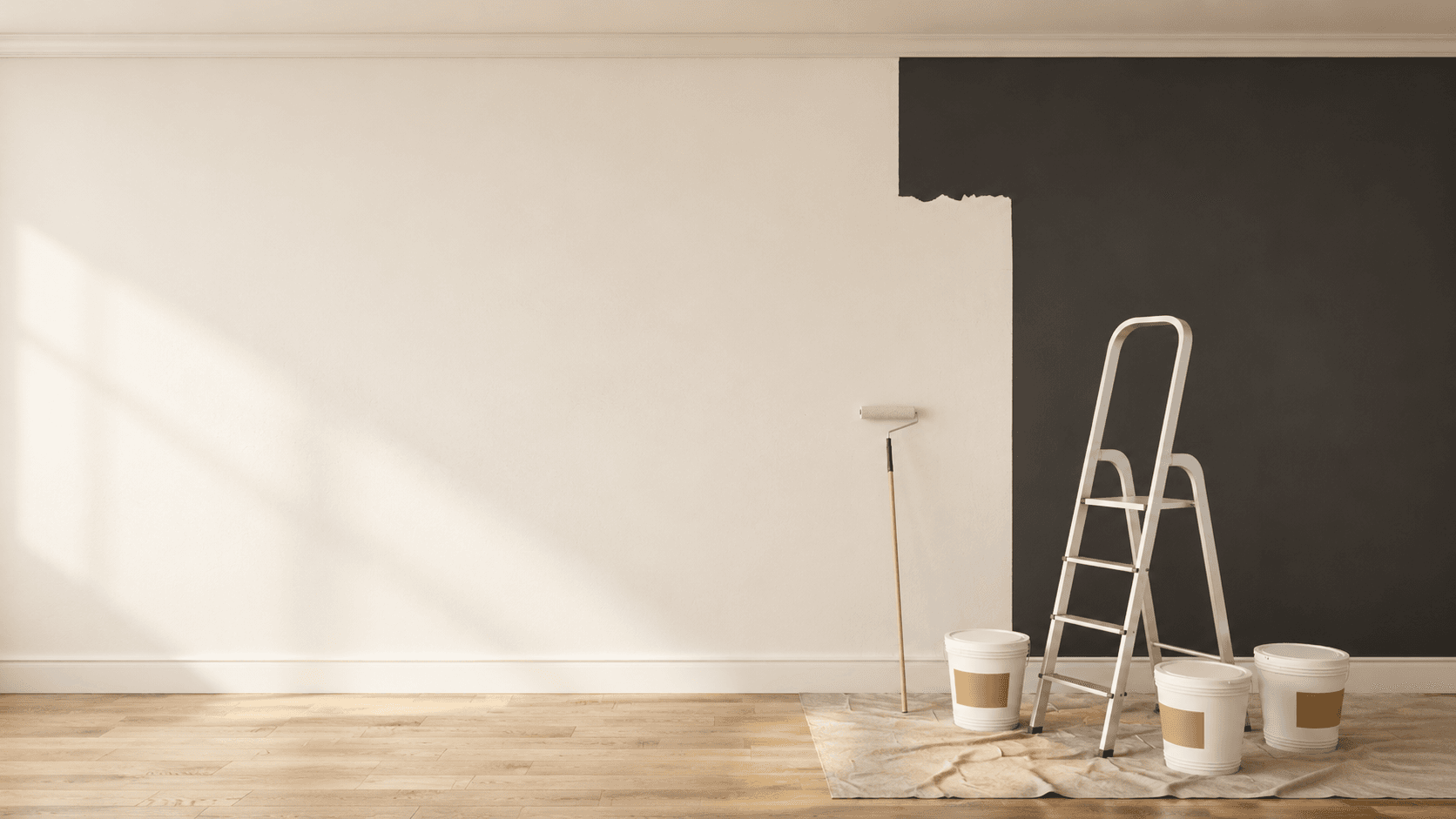 Interior wall mid-paint with ladder, paint buckets, and drop cloth